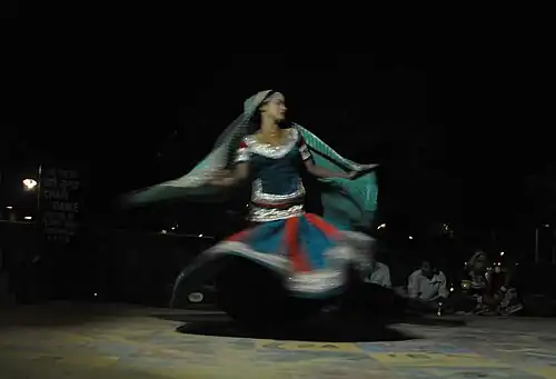 A tribal woman performing ghoomar