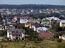 Residential houses, built after 1992 in Gineitiškės village as seen from Pašilaičiai apartment buildingss