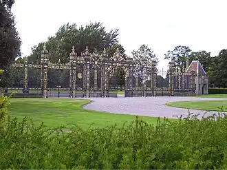Golden Gates and overthrow, screens and pair of wing lodges at Eaton Hall