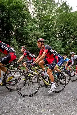 Race winner Greg Van Avermaet during the race, riding a gold bike