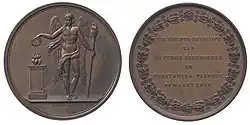 Both sides of a medal. The front depicts Eros or another classical love deity. The reverse has the message in Dutch.