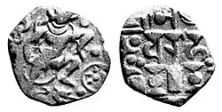Gurjara-Pratihara coinage of Bhoja or Mihara, King of Kanauj, 850-900 CE. Obv: Boar, incarnation of Vishnu, and solar symbol. Rev: "Traces of Sasanian type". Legend: Srímad Ādi Varāha "The fortunate primaeval boar".[23]