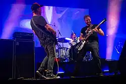 Guitarist Niclas Stalfors, drummer Andreas Eriksson and bassist Peder Bergstrand performing in Clisson, France in 2022.