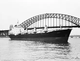 HMAS Jeparit in front of the Sydney Harbour Bridge