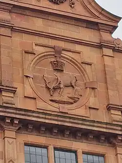 The roundel with the stag and crown, the seal of the local board.