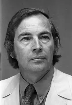 Black-and-white headshot of Christiaan Barnard, a white middle-aged man wearing a white coat.