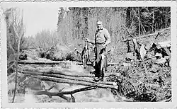 Heisey fishing in stream in Red Lake area 1936