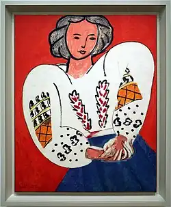 painting of a woman with a blue shirt and white shirt with black, orange, and red embroidery