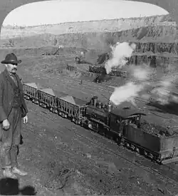 An open-cast iron mining industrial railway in Hibbing, Minnesota, circa 1906