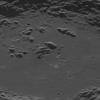 Oblique view of the central crater. Some of the irregular, bright depressions are hollows.