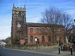 A church with a Neoclassical brick body and a stone Gothic tower