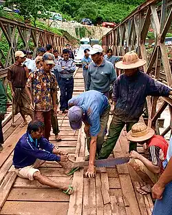 Locals maintaining a bridge
