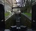 View of Lock 1E and westward behind the University of Huddersfield buildings