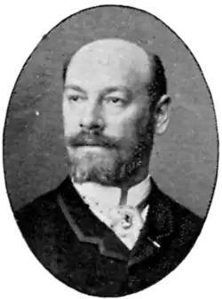 Black and white portrait of Hugo Salmson.