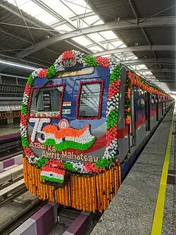 ICF MEDHA rake MR 418 on the inauguration day of Phase 1 of Purple Line at Joka metro station