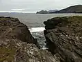 View from Culloo Rock. Dingle Peninsula, Dingle Bay and the north shore of Valentia Island (including Fogher Cliffs) are in the background.