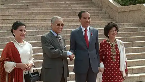 Joko Widodo and his wife, Iriana, meeting with Malaysian Prime Minister Mahathir Mohamad and his wife, Siti Hasmah Mohamad Ali