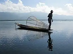 Fisherman rowing on Inle Lake