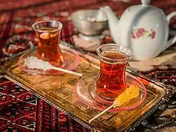 tea in narrow waist glass