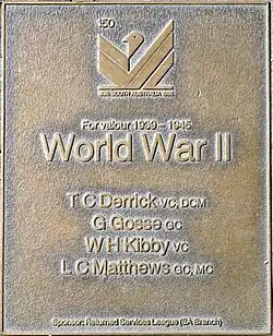 an image of a bronze plaque listing highly decorated service personnel of World War II