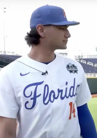 Baseball player standing in uniform