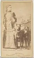 Woman standing with two dogs