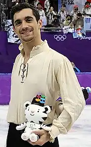 Figure skater Javier Fernandez wearing a shirt with Bishop's sleeves.