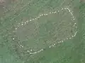 View from above of markers that show the footprint of a rectangular wooden structure near Jeffers Mound