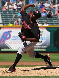 A baseball player in black and gray