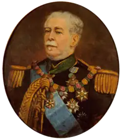 Half-length painted portrait depicting a gray-haired man with moustache wearing a military tunic with epaulettes, lanyards, blue sash, and several medals and orders on his breast and at his neck