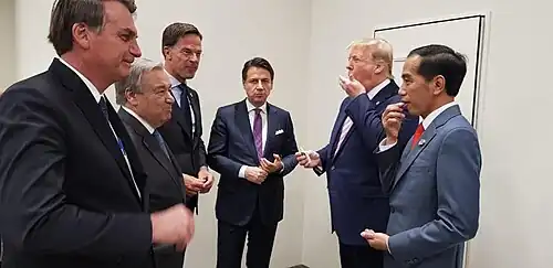 Jokowi with leaders eating Tic-tac candies given by Donald Trump at the G20 Osaka Summit