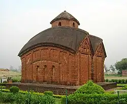 A brick temple with a domed roof