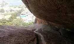Cavern with Panchapandava beds on western slope of the hills and similar beds behind the Sikkandar mosque on the top.