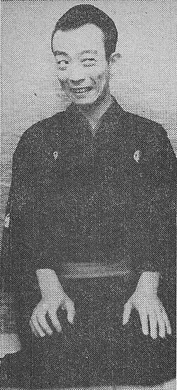 Black and white photo of a man.