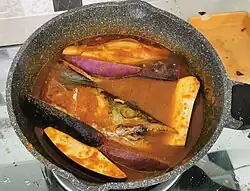 Sweet and sour fish head with terong