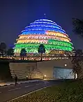 Kigali Convention Centre changes light in the night.