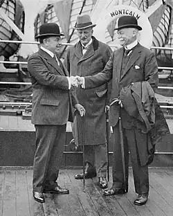 Prime Minister W.L. Mackenzie King and Sir George McLaren Brown being greeted by Hon. Peter Charles Larkin aboard S.S. MONTCALM en route to the Imperial Conference at London