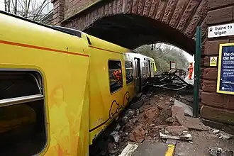 An image of the train and the damaged platform walkway.