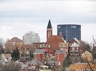 Knoxville, with tops of Pittsburgh skyscrapers in the background