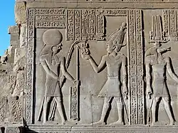 Ptolemy VIII between Re-Horkhty and Sobek. Relief in the Temple of Kom Ombo