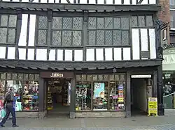 The entrance to Lady Peckett's Yard, leading through the buildings to the right of the shop