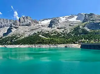 Lake Fedaia with the Marmolada glacier on the background