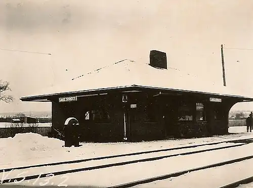 A small railway station covered with snow