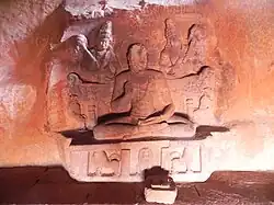 Large seated remains in a natural cavern under the cliff to the south-east of the Bhutanatha temples (Kostharaya cave)