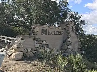 Entrance sign for Las Flores along Oso Parkway