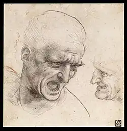 Two male heads in pencil, one close-up, the other miniature.