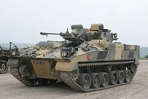 Tank with painted camouflage