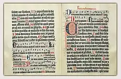 Opening from the Mainz Psalter, printed in 1457, with small printed and large drawn initials.