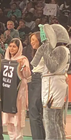 Clara Wu Tsai with Malala Yousafzai and Ellie The Elephant at a NY Liberty Game in 2023