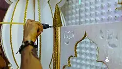 Man working on Tadjah for Hosay